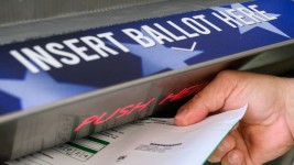 A voter uses a ballot drop box at the Bucks County Administration building voting on demand and ballot drop center in Doylestown, Pennsylvania on October 31, 2024. Ed Jones/AFP/Getty Images