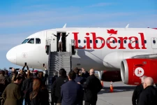 Canadian Prime Minister Mark Carney disembarks a plane in Ottawa on Monday. (Carlos Osorio/Reuters)