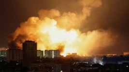 An explosion of a drone lights up the sky over the city during a Russian drone strike in Kyiv, Ukraine, on May 24, 2025.  Gleb Garanich/Reuters