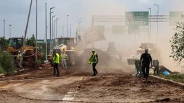 Getty Images / Authorities were seen clearing a road next to the impact site near Ben Gurion aiport