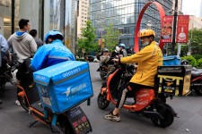 Meituan, a Chinese delivery giant, said it would spend $1 billion to set up operations in Brazil.Credit...Ng Han Guan/Associated Press