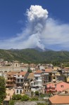 Smoke billows from Mount Etna volcano, seen from the village of Zafferana Etnea, Italy, Monday, June 2, 2025. (AP Photo/Giuseppe Distefano)
