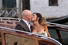 Jeff Bezos and Lauren Sanchez kiss as they leave the Aman hotel in Venice, Italy, for their pre-wedding reception on Thursday, June 26. Luca Bruno/AP