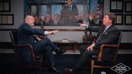 Texas Sen. Ted Cruz, left, and conservative podcast host and commentator Tucker Carlson, right, debate U.S. involvement in the conflict between Israel and Iran in a still image from video released Tuesday. (Tucker Carlson Network/Reuters)
