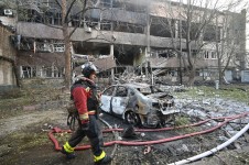 A firefighter walks past a burnt car following a Russian drone strike in Kharkiv, Ukraine, on June 11, 2025. Sergey Bobok/AFP via Getty Images
