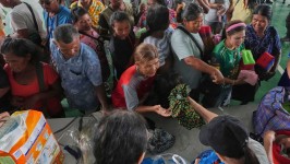 Aid is distributed to some of the thousands displaced in Thailand’s Surin province by fighting on the border with Cambodia © AP