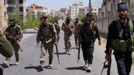 Reuters / The Syrian president says government forces had expelled "outlawed groups" in Suweida city