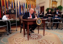 President Donald Trump signs an executive order to reduce the size and scope of the Education Department, during a ceremony in the East Room of the White House on March 20, 2025. Chip Somodevilla, Getty Images