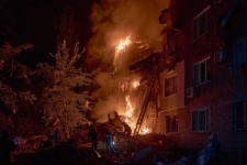 Rescuers work at the site of a residential building hit by a Russian missile in Kyiv, Ukraine, on Thursday, August 28. Libkos/Getty Images