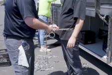 This image from video provided by US Immigration and Customs Enforcement shows a person being handcuffed at the Hyundai Motor Group’s electric vehicle plant, in Ellabell, Georgia, on Thursday. Corey Bullard/AP