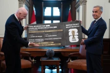 Canada Prime Minister Mark Carney, right, is presented with a novelty World Cup ticket by FIFA President Gianni Infantino on Parliament Hill in Ottawa, Ontario, Friday, Oct. 10, 2025. (Adrian Wyld/The Canadian Press via AP)
