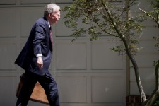 Former White House national security adviser John Bolton arrives at his house following its search by the FBI, in Bethesda, Maryland, U.S., August 22, 2025. REUTERS/Tasos Katopodis Tasos Katopodis/Reuters