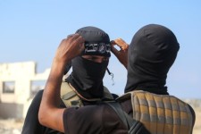 Hamas militants with the Qassam Brigades in Deir el-Balah, central Gaza, on Monday.Bashar Taleb / AFP via Getty Images