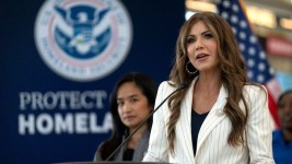 The Department of Homeland Security issued new travel guidance requiring foreigners to be photographed when they enter or leave the country. (AP Photo/Mark Schiefelbein)