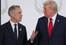 Donald Trump greets Canada's prime minister, Mark Carney (left), on 13 October 2025. Photograph: Evan Vucci/AFP/Getty Images