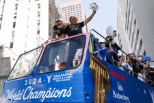The Dodgers make their way down the streets during a victory parade celebrating the team’s 2024 World Series title.   (Carlin Stiehl / For The Times)