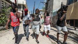 Gang Leader Jimmy "Barbecue" Cherizier patrolling the streets with G-9 federation gang members in the Delmas 3 area on Feb. 22, 2024, in Port-au-Prince, Haiti. (Photo by Giles Clarke/Getty Images)