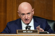 Mark Kelly speaks during the Senate confirmation hearing for Pete Hegseth on 14 January 2025. Photograph: Ben Curtis/AP