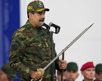 President Nicolás Maduro holds a ceremonial sword said to have belonged to independence hero Simón Boíivar at an event in Caracas on Tuesday. Photograph: Ariana Cubillos/AP