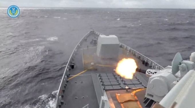 A still image from a video released by the Chinese military shows a ship firing during the drills. EASTERN THEATRE COMMAND/REUTERS