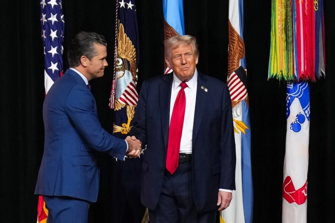 US President Donald Trump and Defense Secretary Pete Hegseth shake hands at Marine Corps Base Quantico.  Photographer: Andrew Harnik/Getty Images
