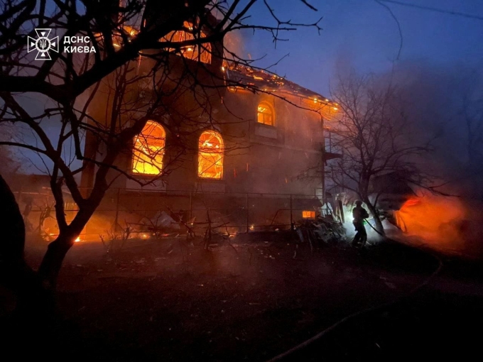 A firefighter works at the site of a residential building damaged during Russian missile and drone strikes, amid Russia's attack on Ukraine, in Kyiv, Ukraine on December 27, 2025.  State Emergency Service of Ukraine/Reuters