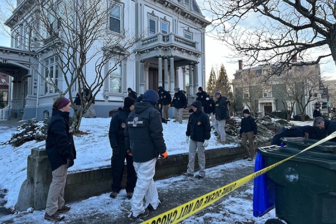 FBI officials search an area of Providence, R.I., Monday, Dec. 15, 2025. Leah Willingham/AP