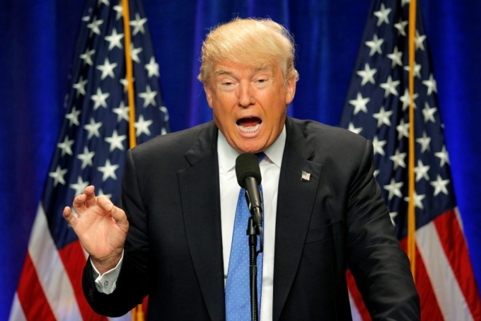 Left: Republican presidential candidate Donald Trump delivers a campaign speech about national security in Manchester, New Hampshire. Photo by Brian Snyder/Reuters