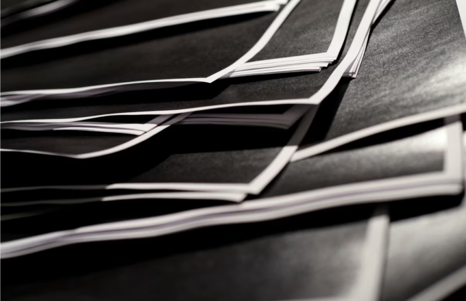 Newly-released documents from disgraced late financier and sex offender Jeffrey Epstein, including a sheaf of entirely redacted pages, are seen in this handouts released by the US Justice Department and printed and arranged for a photograph by Reuters.