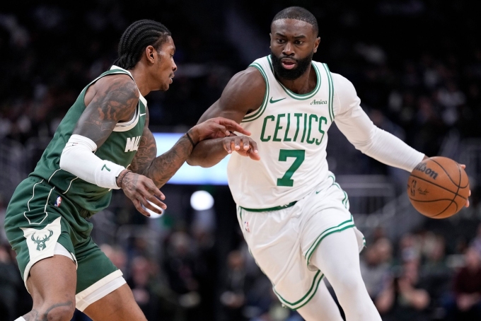 Jaylen Brown, of the Boston Celtics, drives to the basket on Kevin Porter, Jr., of the Milwaukee Bucks.Photograph by John Fisher / Getty