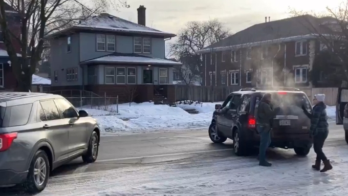 Another view of the incident filmed by a bystander showing Rebecca behind her wife's car (pictured right). Picture: Supplied