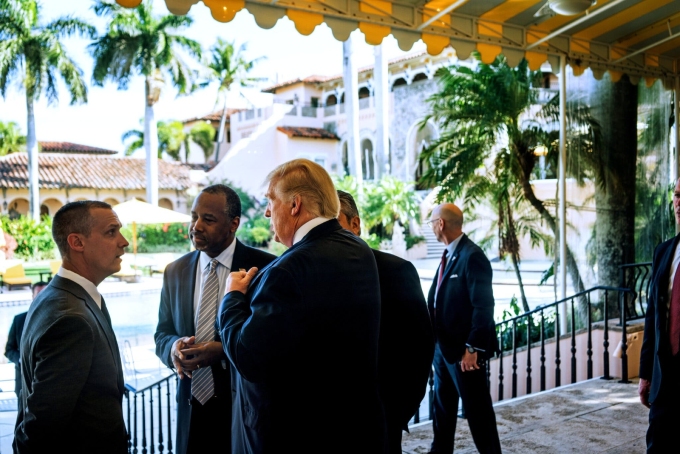 Mr. Lewandowski with Ben Carson and Mr. Trump at Mar-a-Lago in 2016.Credit...Todd Heisler/The New York Times