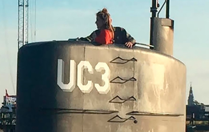 This picture, reportedly of Swedish journalist Kim Wall standing next to a man in the tower of the private submarine could shed light on what happened in the moments before her death. Photo / AFP