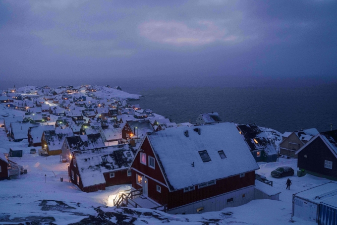 Houses covered by snow are seen on the coast of a sea inlet of Nuuk, Greenland, on Monday, January 12, 2026. (AP Photo/Evgeniy Maloletka)  Evgeniy Maloletka/AP