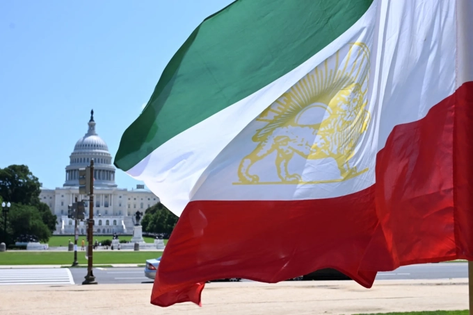 The old flag of Iran in front of the US Capitol in Washington. Photographer: Alex Wroblewski/AFP/Getty Images