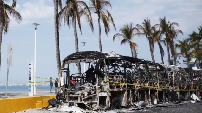 EPA / The remains of burned out vehicles can still be seen on the streets of cities in Jalisco state