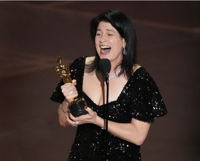 Cassandra Kulukundis accepts the Oscar for casting at the Dolby Theatre in Los Angeles, California, on Sunday. Photograph: Chris Pizzello/Invision/AP
