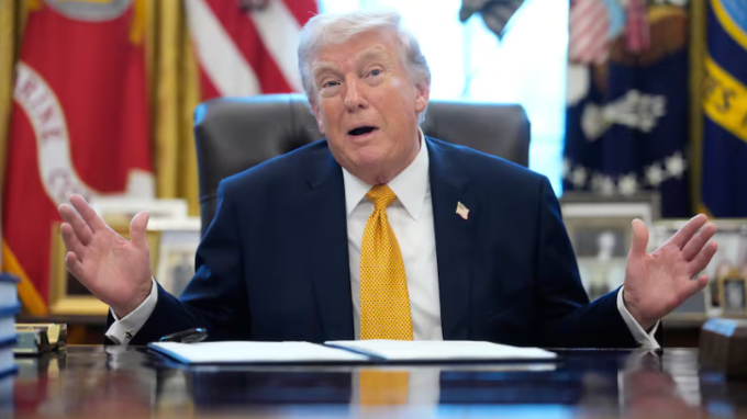 U.S. President Donald Trump speaks before signing an executive order in the Oval Office of the White House on Monday. (Julia Demaree Nikhinson/The Associated Press)