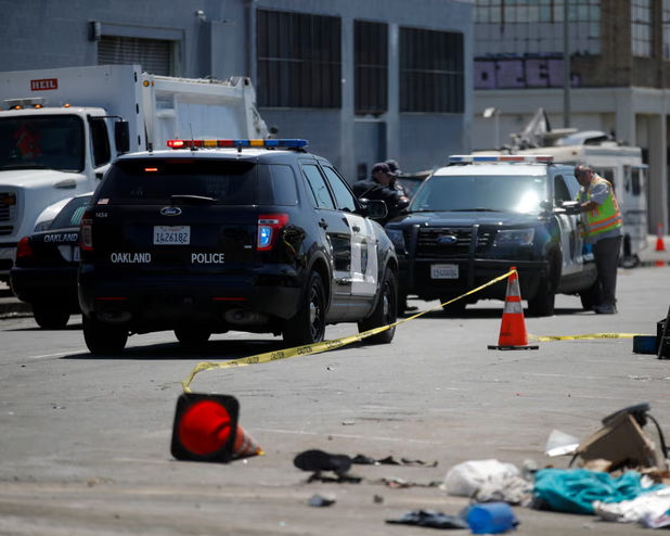 Oakland police at an unhoused encampment. Prop 36 is leading to a statewide crackdown on minor crimes often tied to California’s homelessness crisis. Photograph: MediaNews Group/East Bay Times/Getty Images