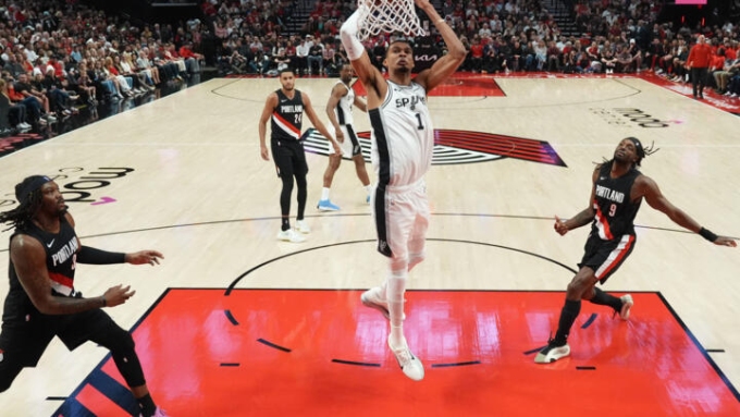 San Antonio's Victor Wembanyama throws down a dunk in the Spurs victory over the Portland Trail Blazers in game four of their NBA playoff series © Soobum Im / GETTY IMAGES NORTH AMERICA/AFP