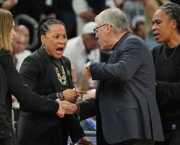 Dawn Staley and Geno Auriemma exchange words near the end of Friday night’s game. Photograph: Rick Scuteri/AP