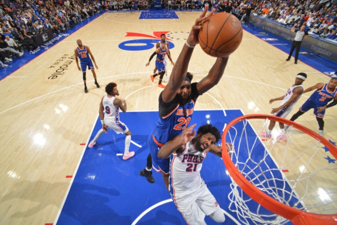 The Knicks’ Mitchell Robinson dunks the ball over the 76ers’ Joel Embiid in Game 3 of the second-round playoff series. Jesse D. Garrabrant/NBAE/Getty Images