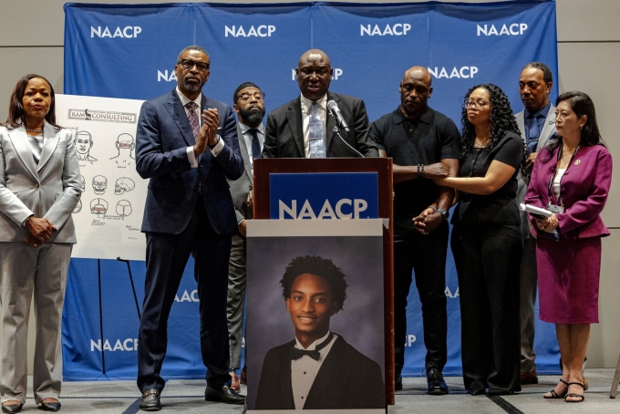 Ben Crump, a lawyer for the family of Nolan Wells, announces the preliminary results of an independent autopsy for Nolan Wells on Wednesday.  Jim Vondruska/Reuters