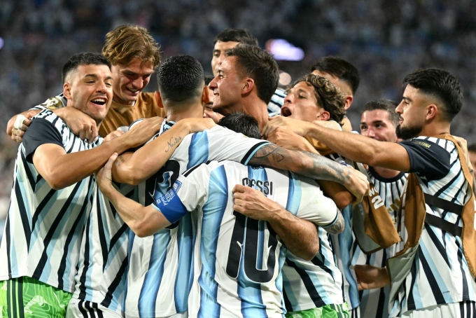 Cristian Romero celebrates with teammates scoring his team's third goal against Cape Verde on Friday. Chandan Khanna/AFP/Getty Images
