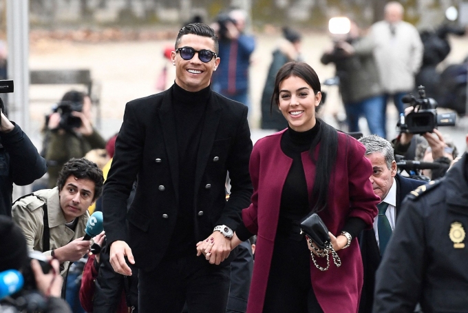 Cristiano Ronaldo (left) and Georgina Rodriguez (right) are pictured in Madrid in 2019. Pierre-Philippe Marcou/AFP/Getty Images/File