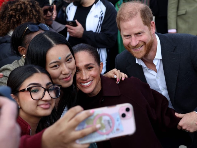 The couple posed for selfies with well-wishers waiting outside. Picture: Darren Staples/AFP