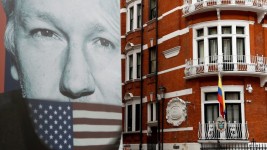 FILE PHOTO: A truck carrying a poster relating to WikiLeaks founder Julian Assange is driven away from the Ecuadorian embassy, London, April 5, 2019 © Reuters / Peter Nicholls