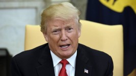 President Donald Trump speaks in the Oval Office of the White House on April 30. (Olivier Douliery-Pool/Getty Images)