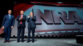 GETTY IMAGES Image caption Trump at a National Rifle Association event, the largest US gun lobby, in April