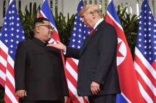 US President Donald Trump gestures as he meets with North Korea's leader Kim Jong Un at
